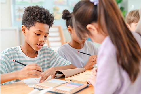 Three students in a classroom
