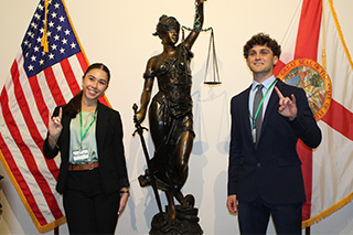 Two students give the Go Bulls hand signal