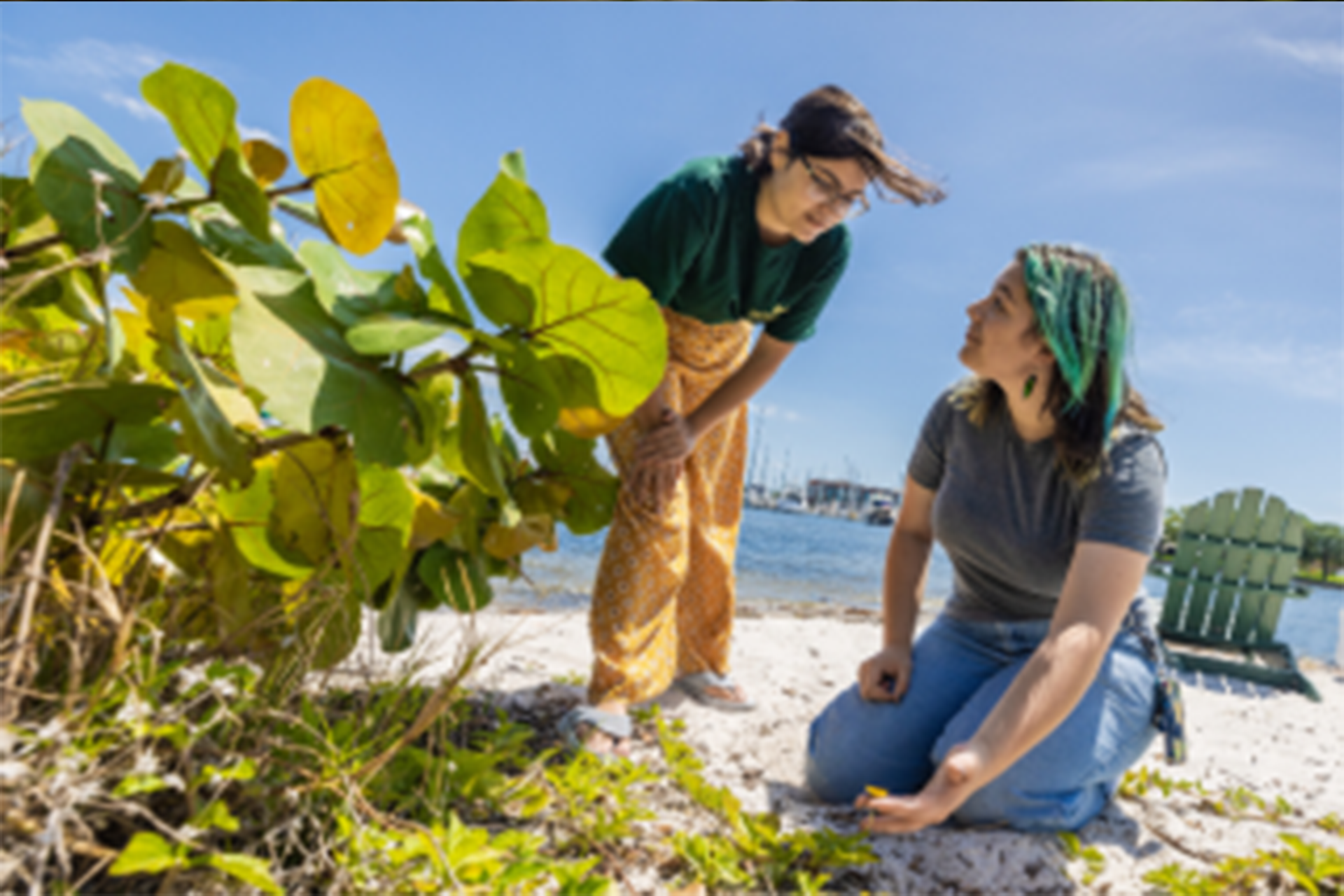 Audrey Brandt helping a student on the beach