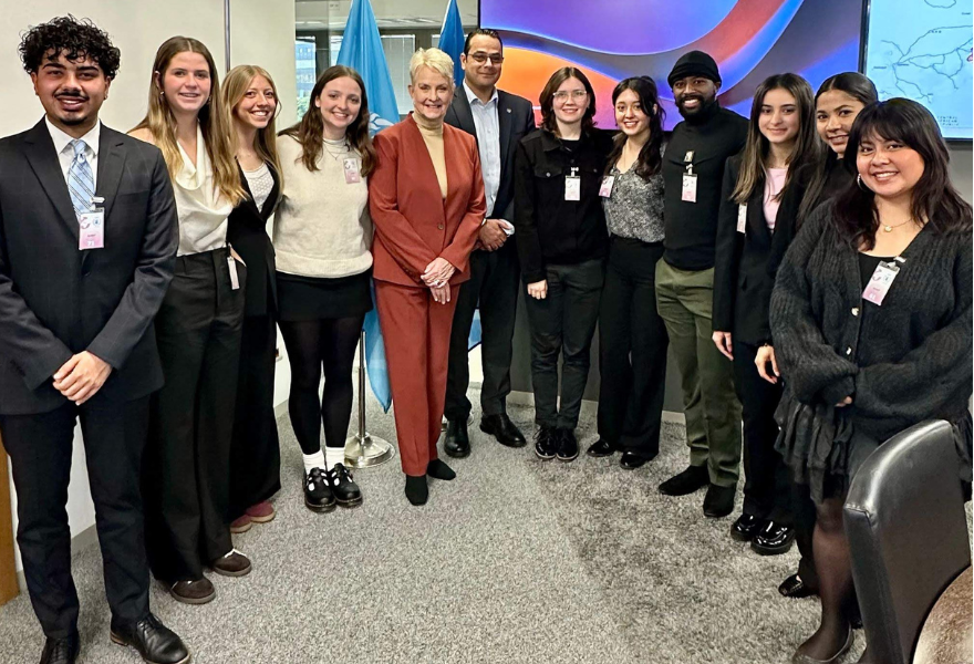 Study tour participants stand together at World Food Programme with Executive Director