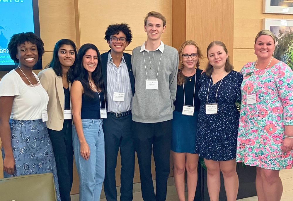 A group of students pose with Fulbright Program Advisor, Lauren Chambers.