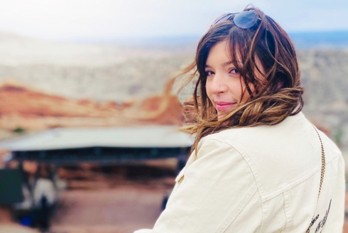 Emily looking over shoulder at camera