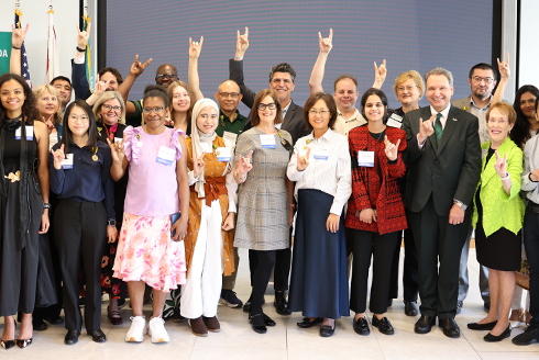 USF Fulbright Scholars show their bull pride with President Limayem in the Judy Genshaft Honors College