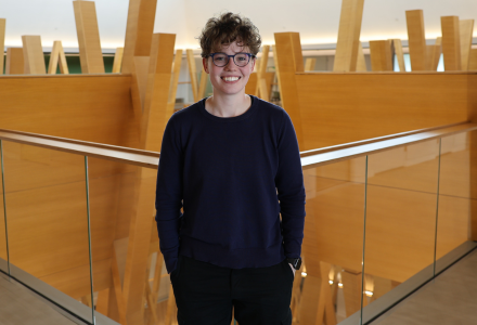 Gray standing in Honors College