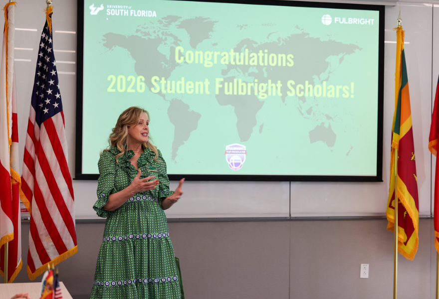 Vice President of USF World Kiki Caruson congratulates the recipients at the USF Fulbright U.S. Student Program Recognition Ceremony.