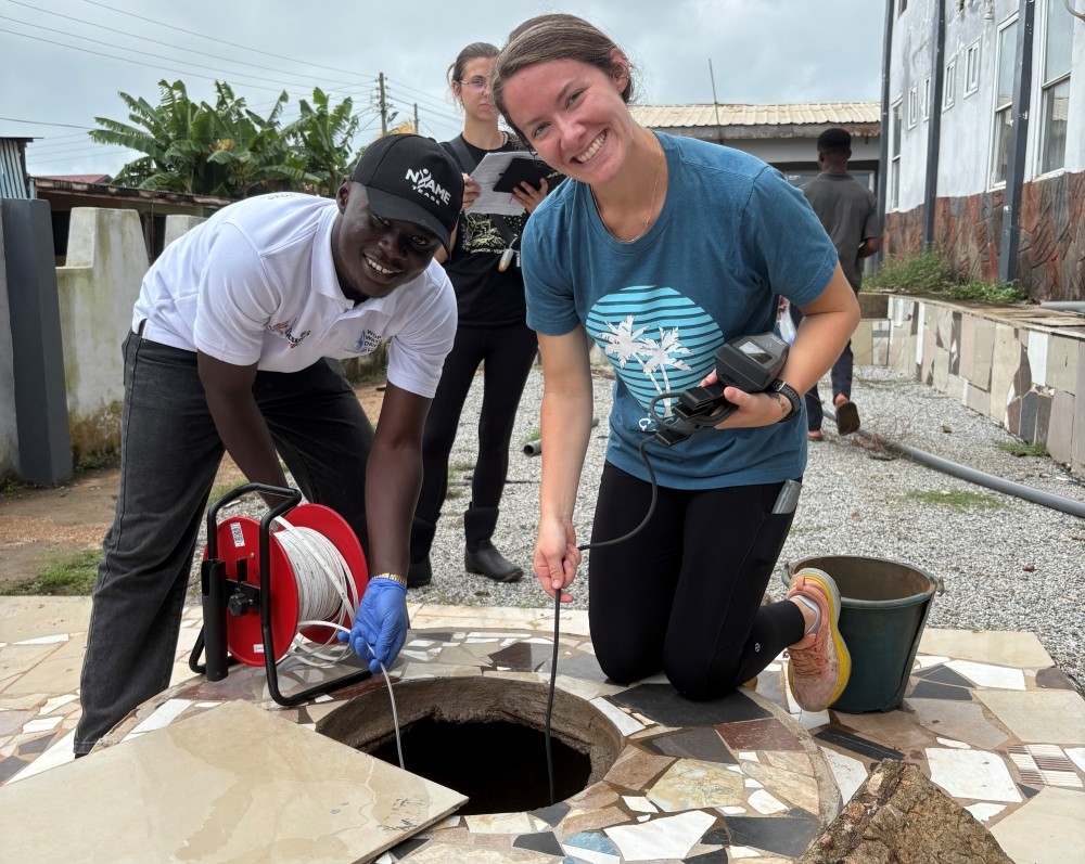 cassidy and a team member analyzing a well
