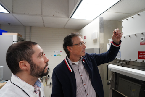 Dean Philippidis examining new material