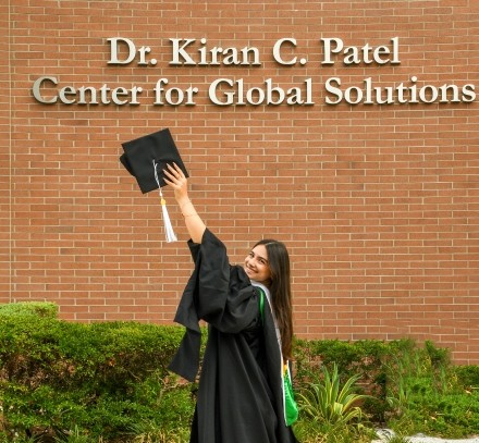 Victoria outside of Patel College of Global Sustainability after graduating.