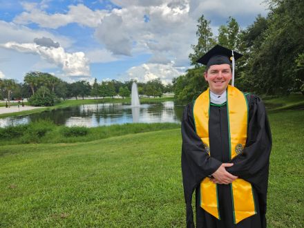 WIlliam in his graduation cap and gown