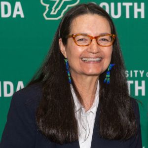 brunette woman smiling at camera