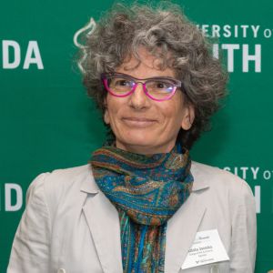 woman looking of in distance wearing glasses