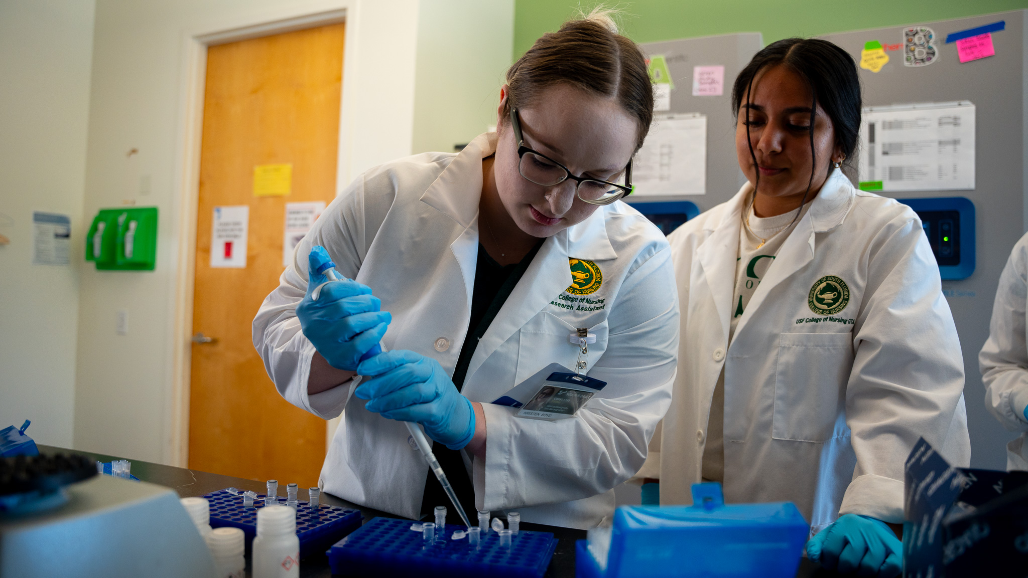two nursing students using pipette