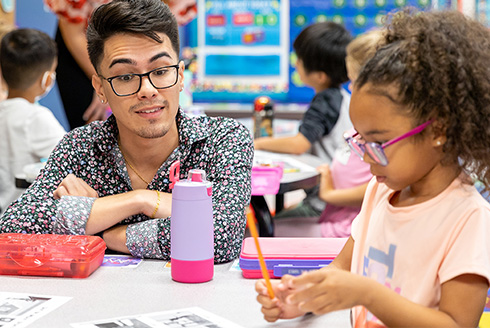 Teacher and student at a table