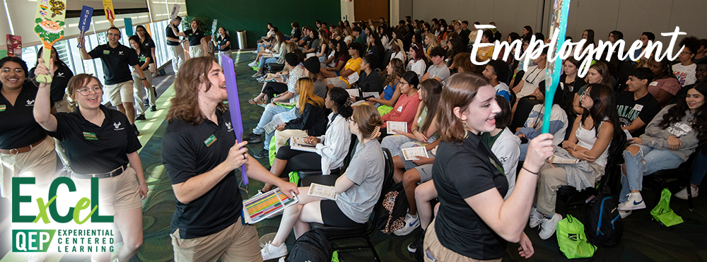 group of orientation student employees greeting new freshman class