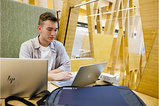 student working on a laptop