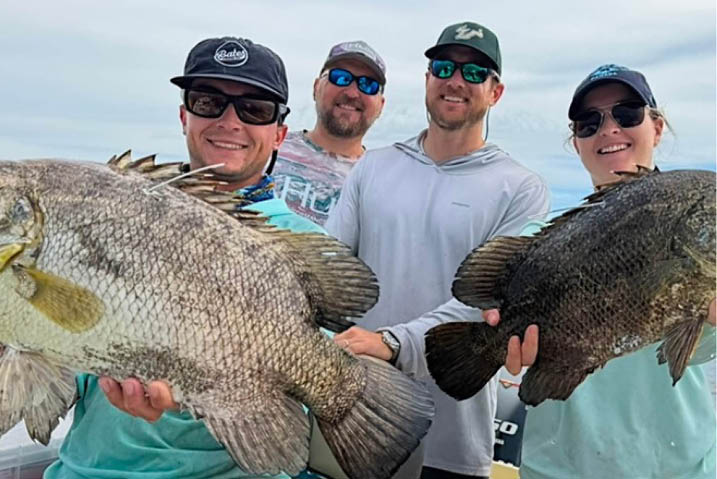 USF Assistant Professor Lucas Griffin, center, and research partners during cobia fieldwork