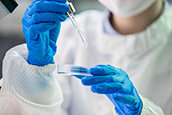 scientist with Petri dish
