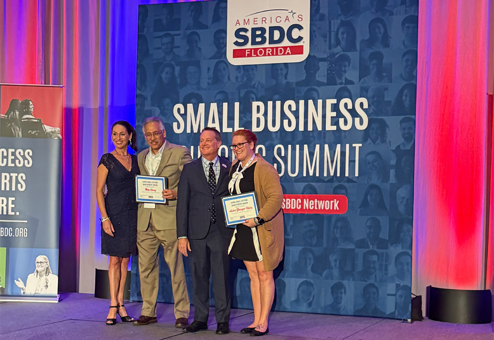 SBDC award winners on stage
