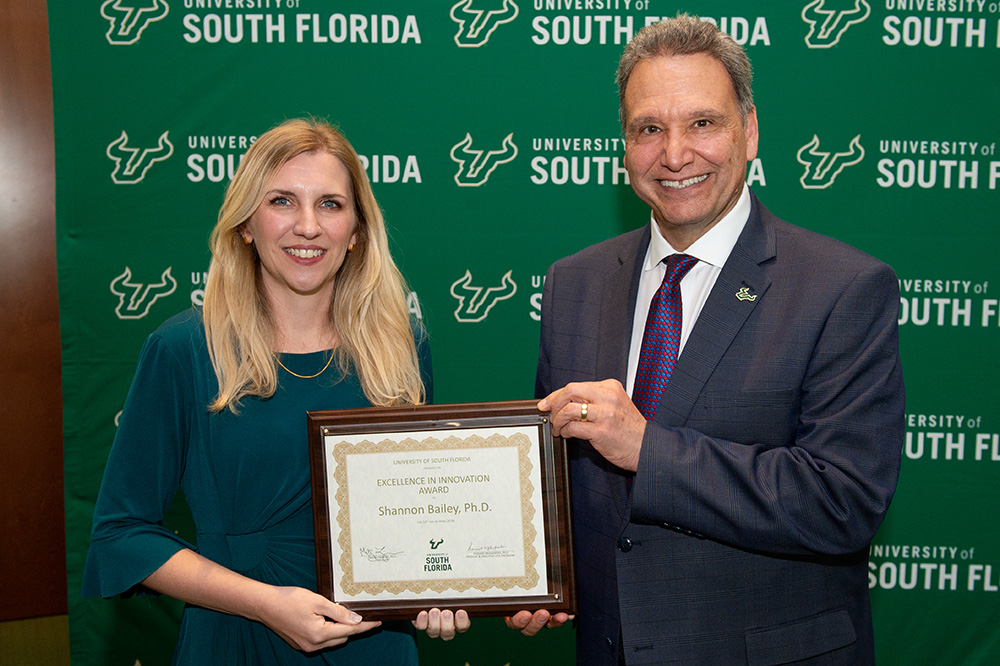 Shannon Bailey with President Limayem