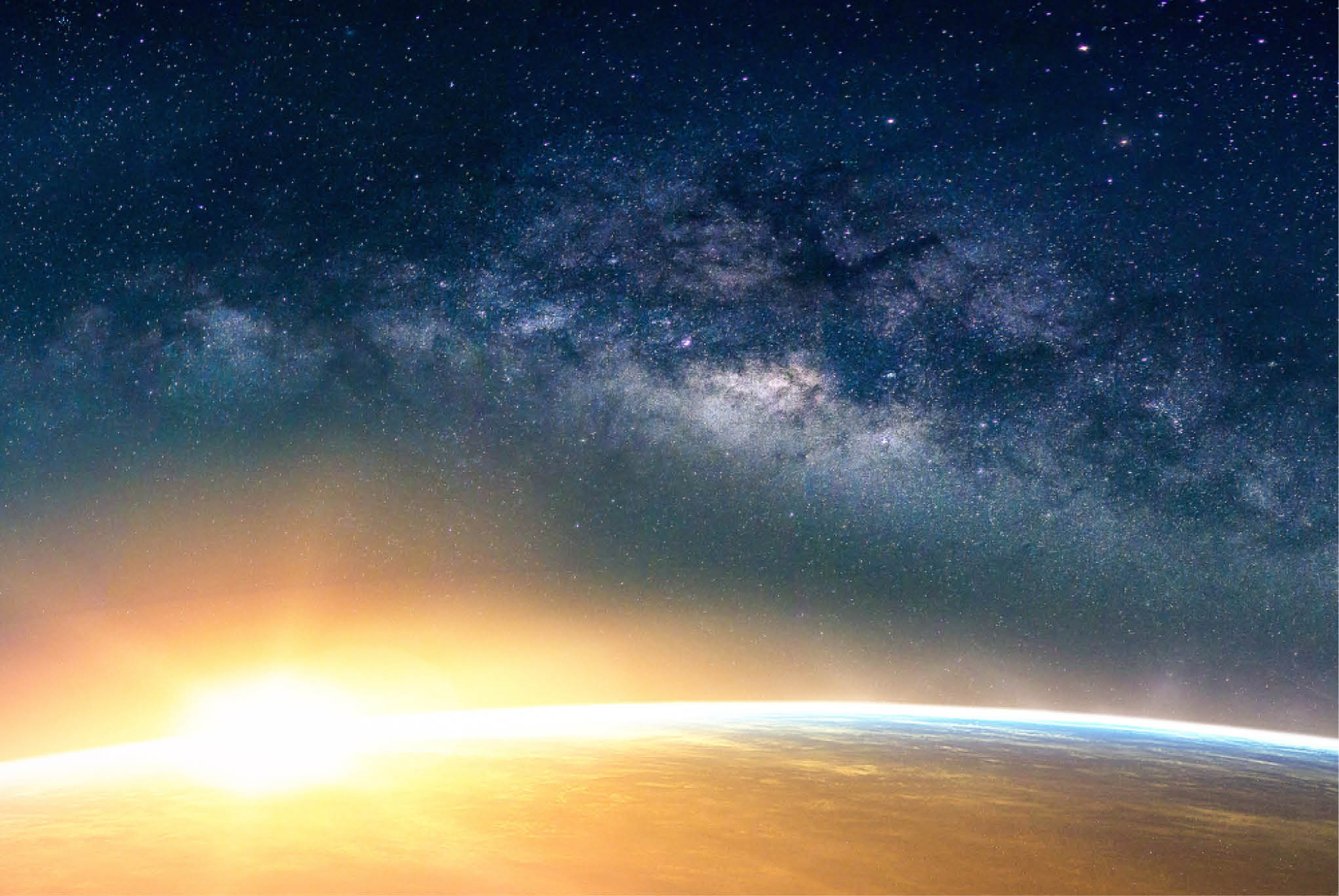 A view of the earth from space with the radiating just over the horizon