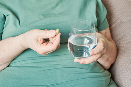 woman taking supplement