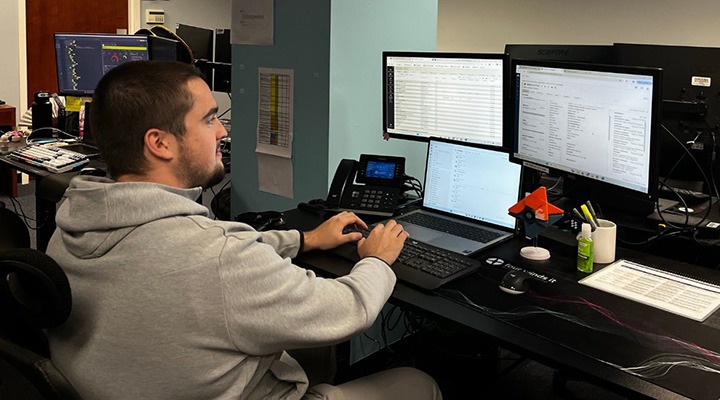 Four Winds IT intern at computer