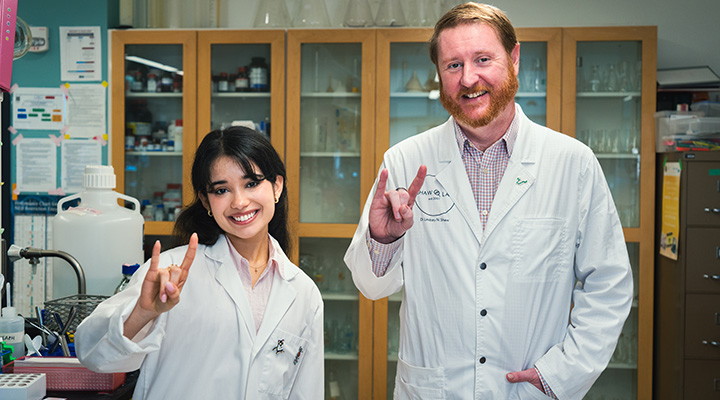 Professor Les Shaw with student in lab