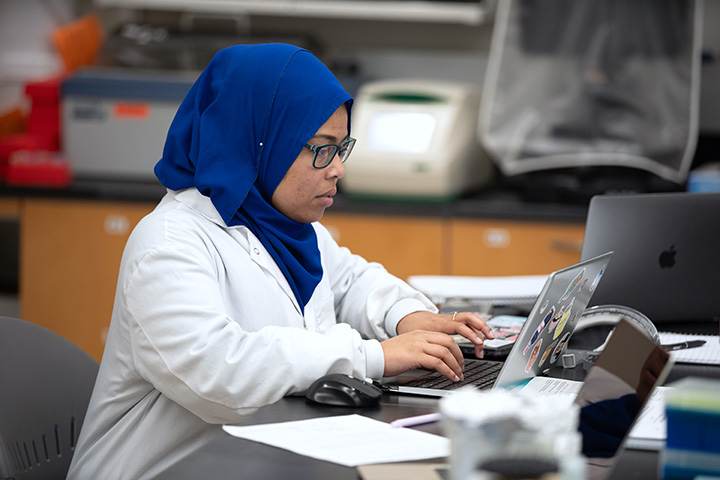 researcher at laptop