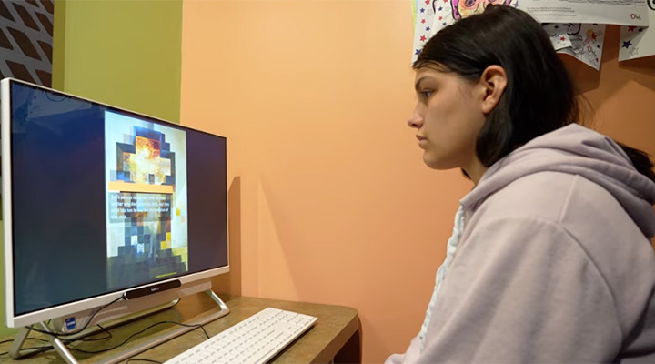 student looking at computer at Dali Museum