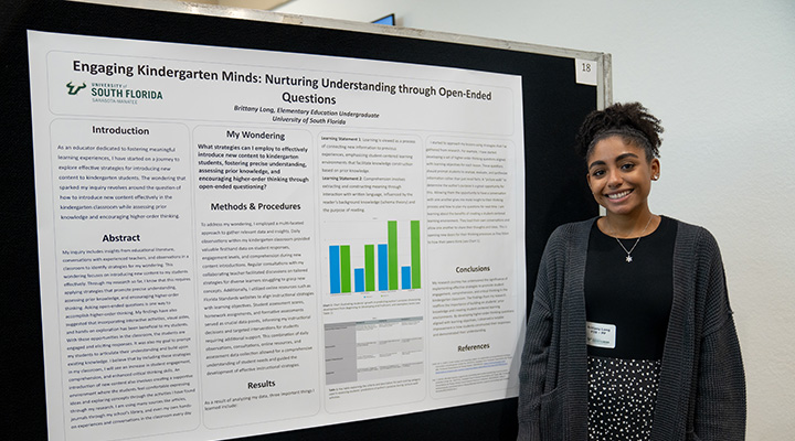 undergrad with poster