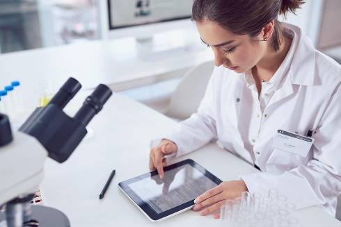 Woman in lab on a computer