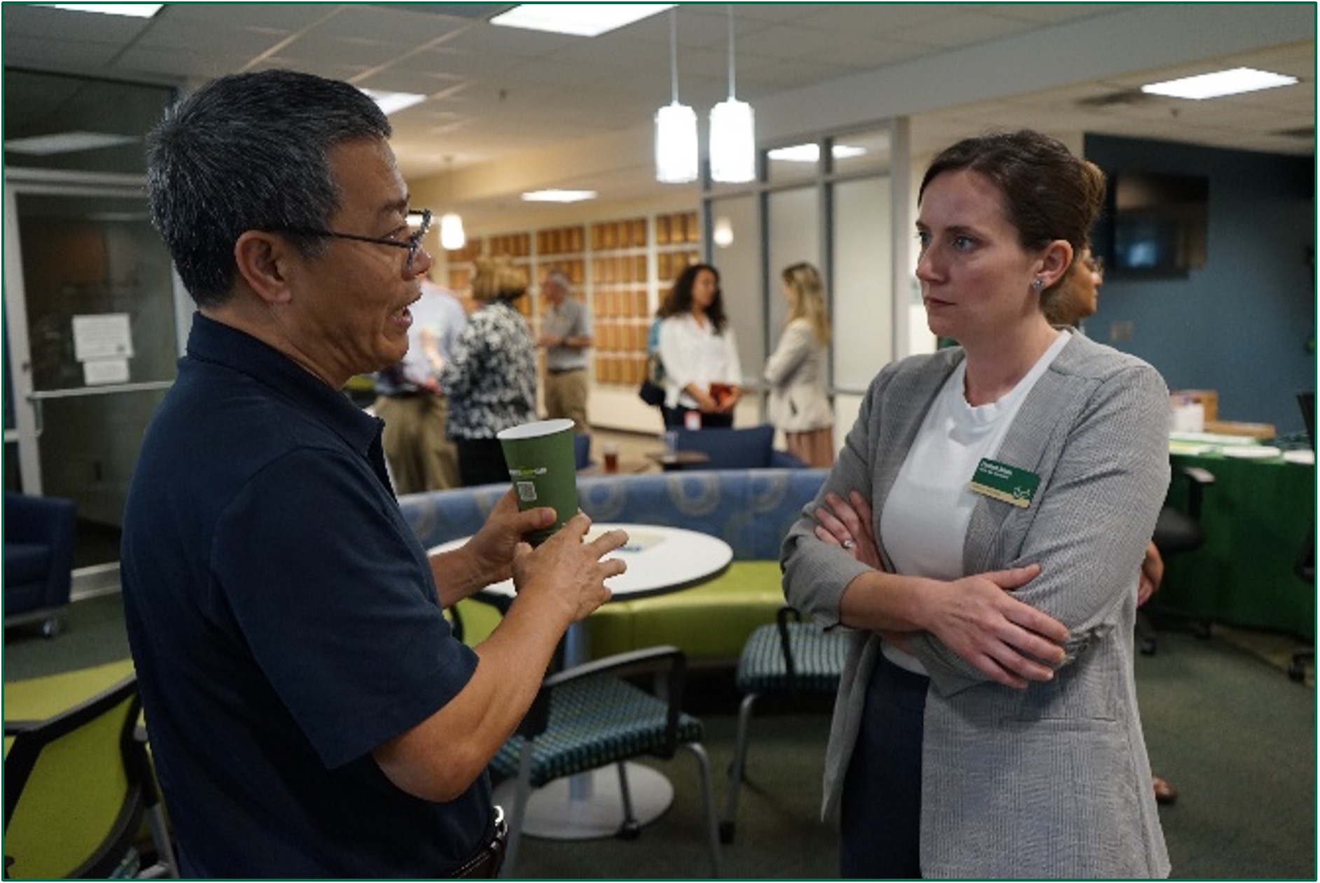 Two faculty members having a conversation
