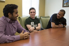 three young men in a group