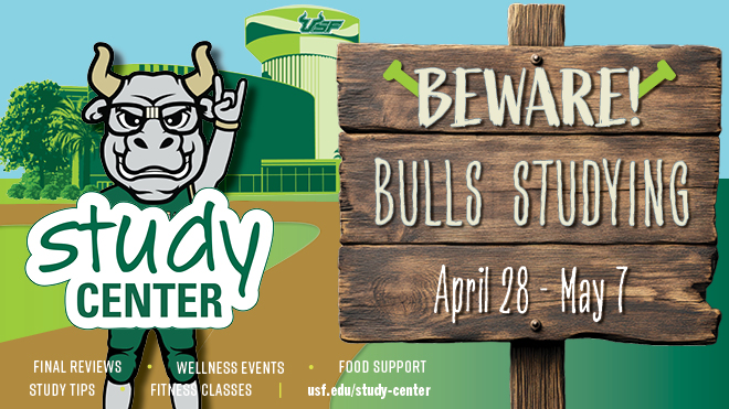 Rocky with glasses standing by Bulls Studying sign