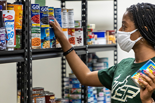 USF member being taking part in the food pantry.