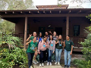 Team photo outside of the cabin before heading home.