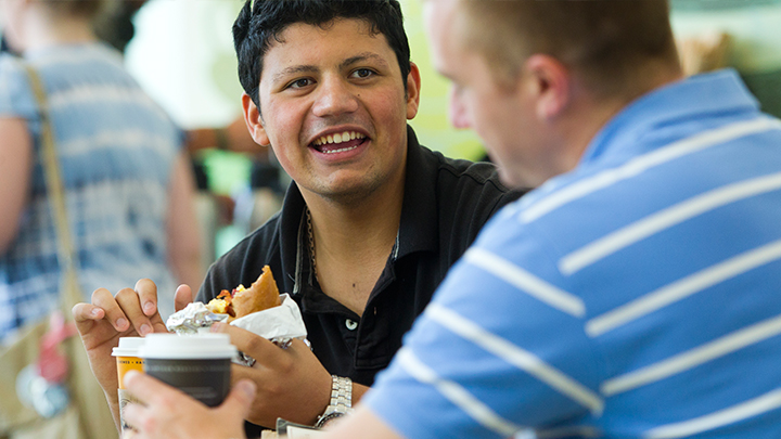 Man eating and smiling