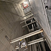 Looking up from the bottom of the empty elevator shaft for car 1.