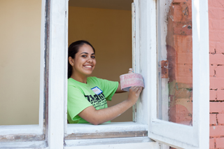 Girl smiling in window