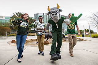 Rocky the bull and students walking with each other