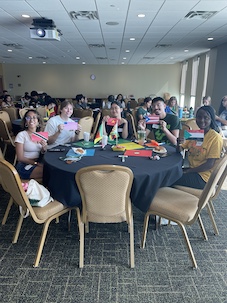 students at table with flags