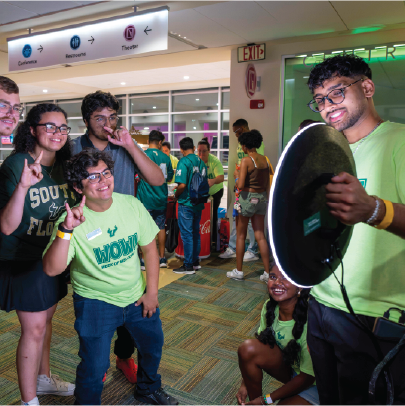 Peer advisor leaders using the Photo Booth with new students at week of welcome.