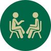 a green circle with two people in the center talking