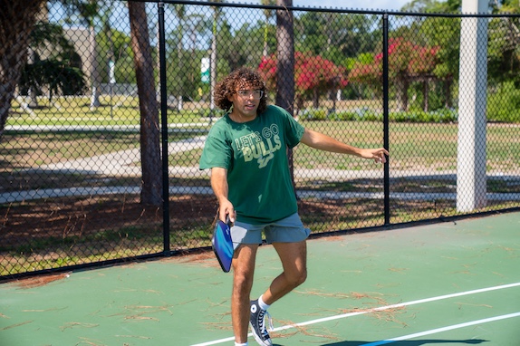 Student playing pickleball