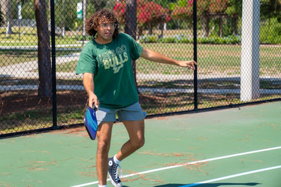Student playing pickleball