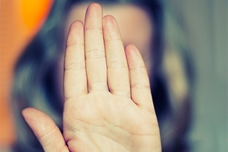 woman with her hand up