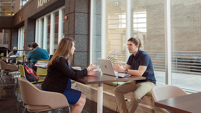 Advisor and Student Conversating