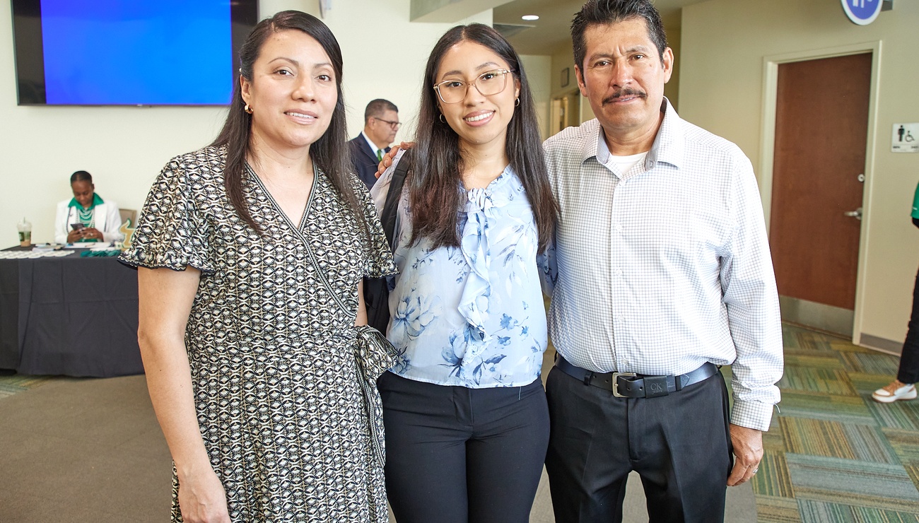 student with mom and dad
