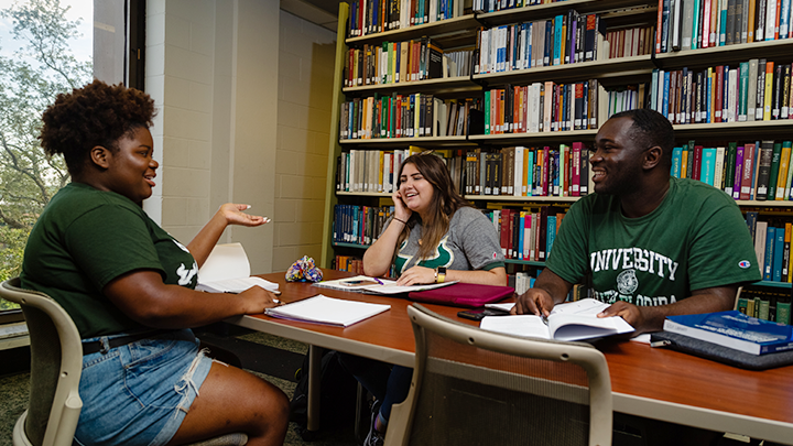 students studying at library