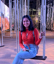 Harshita Mistry, ACE Mentor, sitting on a swing